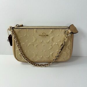 Cream Coach wristlet with gold chain